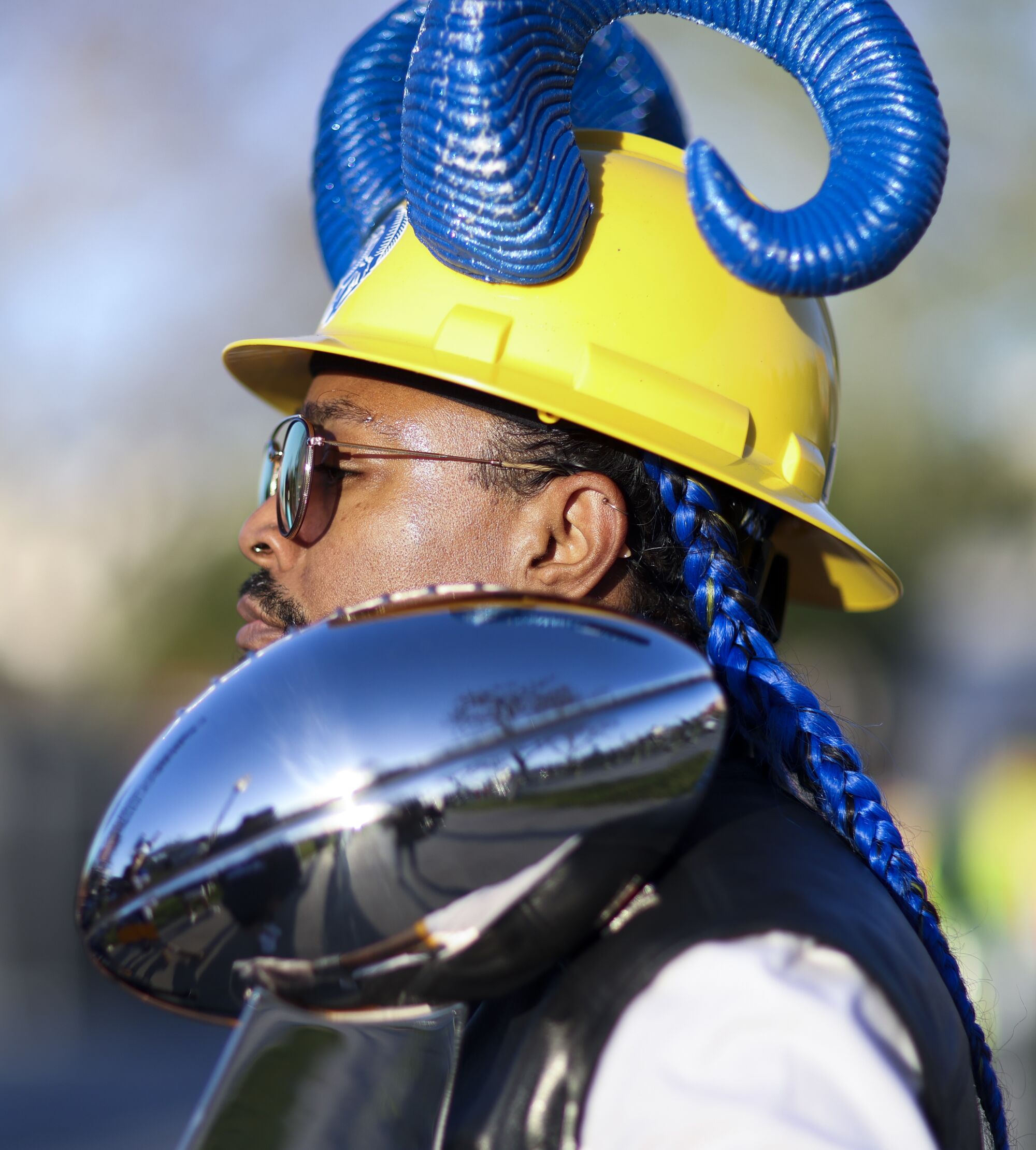A.J. Watson of Lakewood poses with a Lombardi Trophy replica before the Rams parade