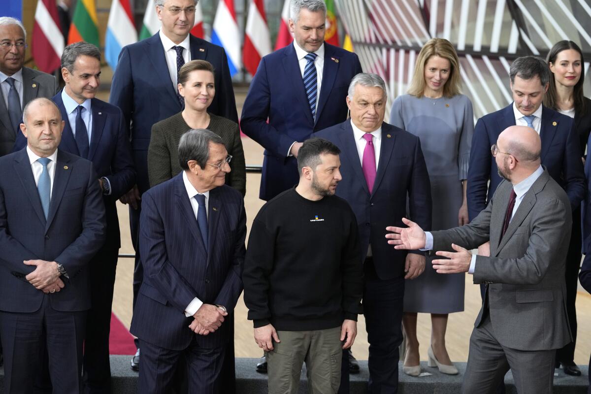 European Council President Charles Michel speaks with Ukrainian President Volodymyr Zelensky and others at a EU summit. 
