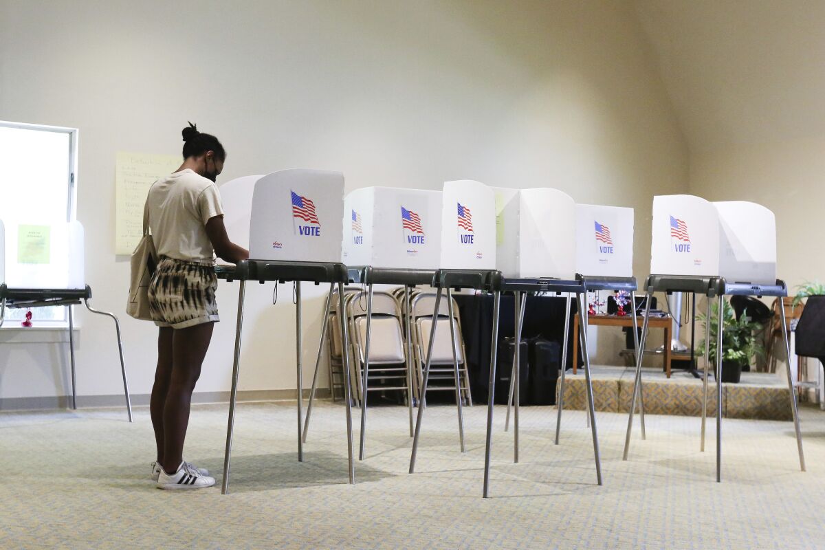Briana Thornton votes in the state's primary election at Unity Church of Tidewater in Virginia Beach, Va.