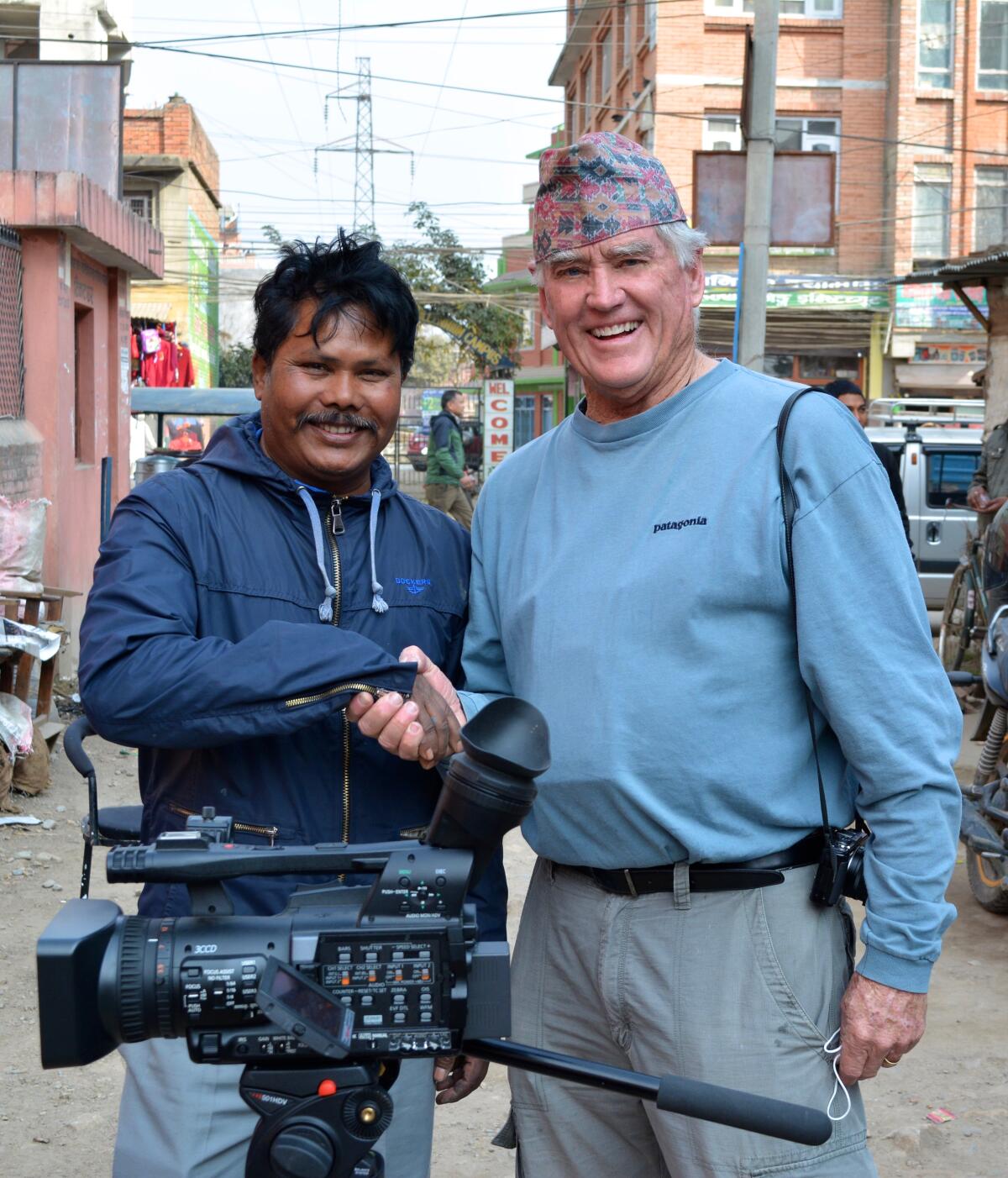 San Diego filmmaker Ron Ranson, right, is shown with truck painter Kunil Kumar Choudary on location in Nepal.