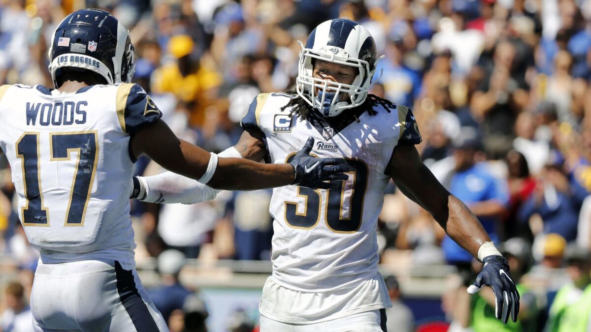 Rams running back Todd Gurley (30) celebrates with Rams wide receiver Robert Woods (17) against the Arizona Cardinals.