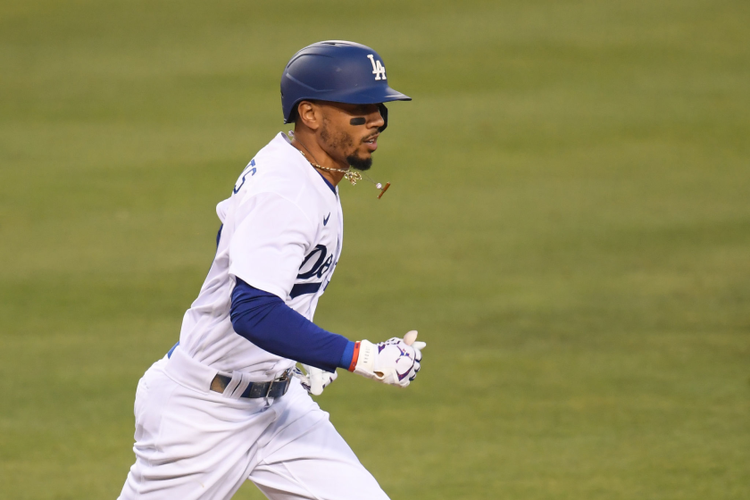 Dodgers right fielder Mookie Betts runs to first base.