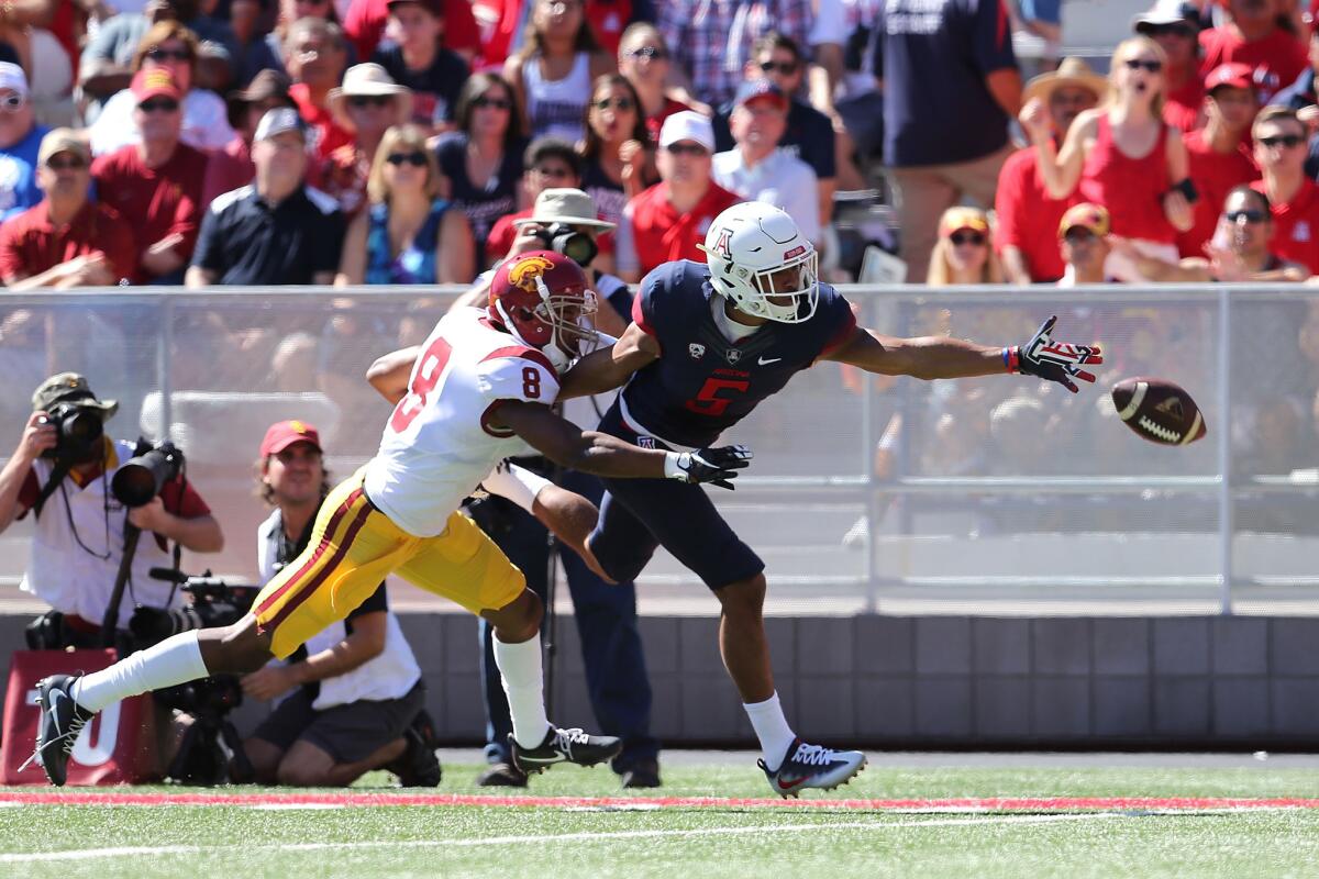 Arizona receiver Trey Griffey can't haul in a pass while being defended by USC defensive back Iman Marshall during the first quarter of a game on Oct. 15.