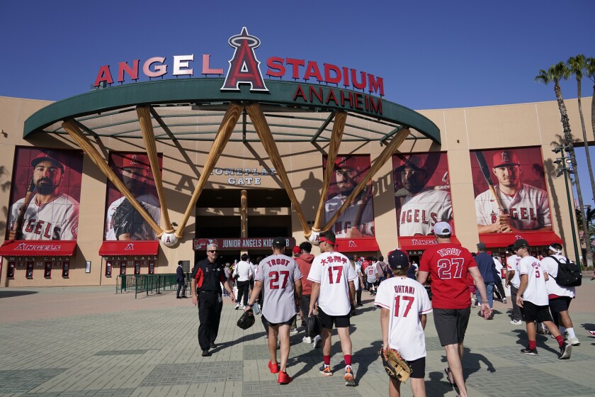 Fans enter Angels Stadium before a baseball game.