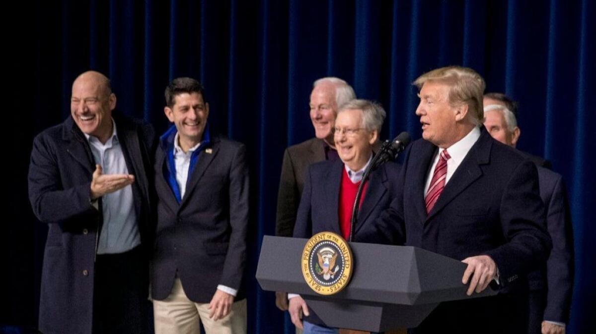 President Trump and Republican congressional leaders celebrate their tax-cut package.