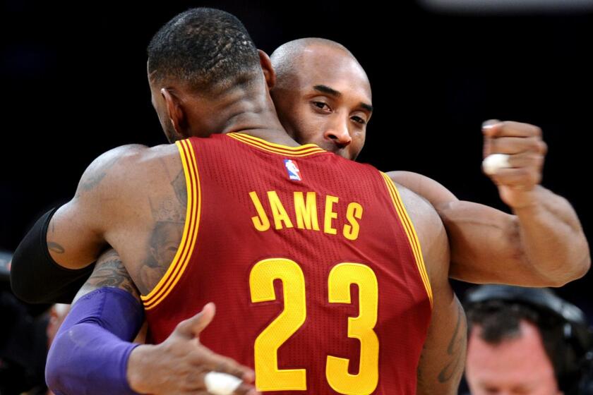 LOS ANGELES, CALIFORNIA MARCH 10, 2016-Lakers Kobe Bryant hugs Cavaliers LeBron James before the start of the game at the Staples Center Thursday. (Wally Skalij/Los Angeles Times)