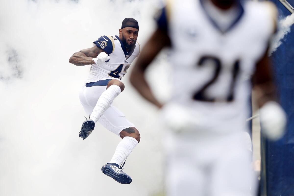 Rams safety John Johnson jumps onto the field before a game against the New Orleans Saints on Sept. 15.