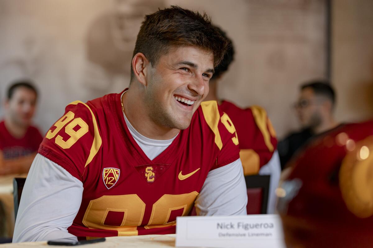 USC defensive lineman Nick Figueroa talks to reporters at media day in August.