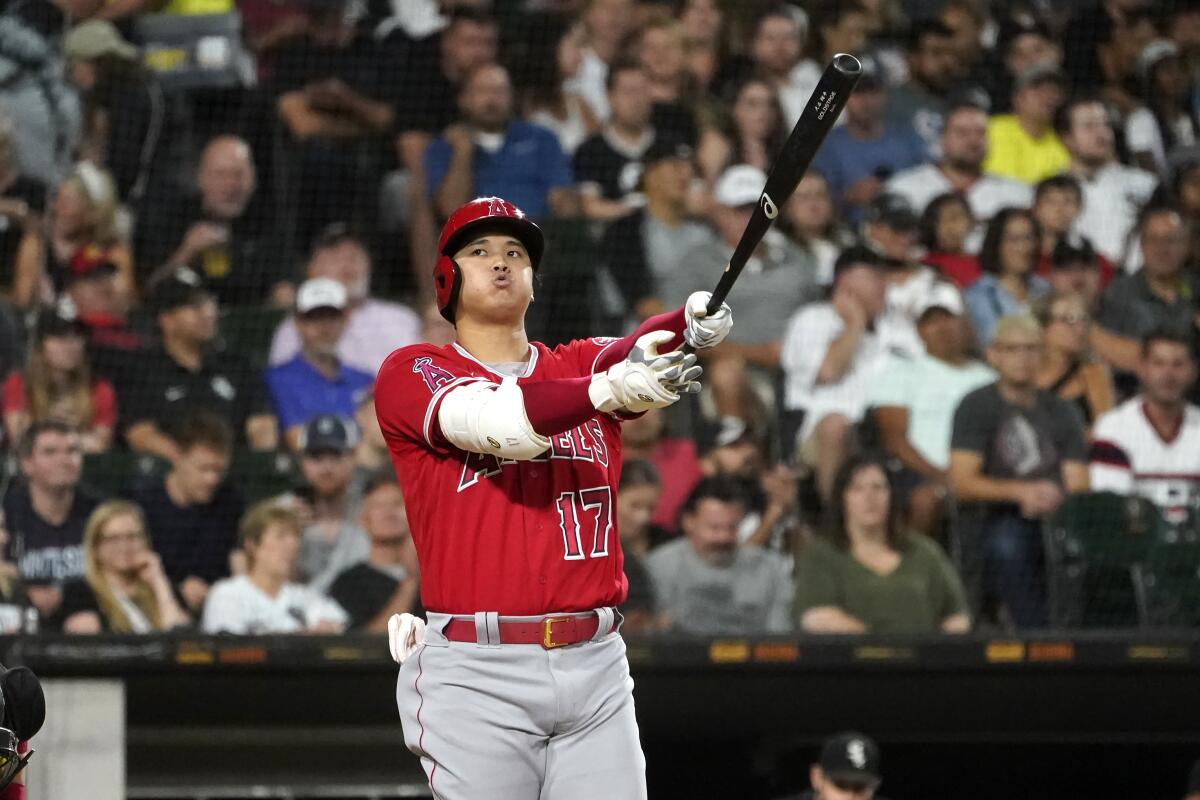 Angels two-way star Shohei Ohtani exhales after swinging at a pitch from Chicago White Sox's Lucas Giolito 