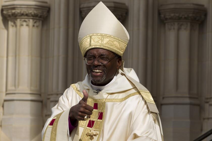 Episcopal Church Presiding Bishop-elect Michael Curry arrives at the Washington National Cathedral on Sunday.