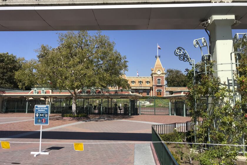 ANAHEIM, CA - SEPTEMBER 30: A view of the entrance to Disneyland Park, which has been closed since March 14 due to the coronavirus pandemic, Wednesday, Sept. 30, 2020 in Anaheim, CA. After suffering losses for months due to Gov. Newsom's mandatory coronavirus shut-down, Disney says it will lay off 28,000 employees across its parks, experiences and consumer products segment.(Allen J. Schaben / Los Angeles Times)