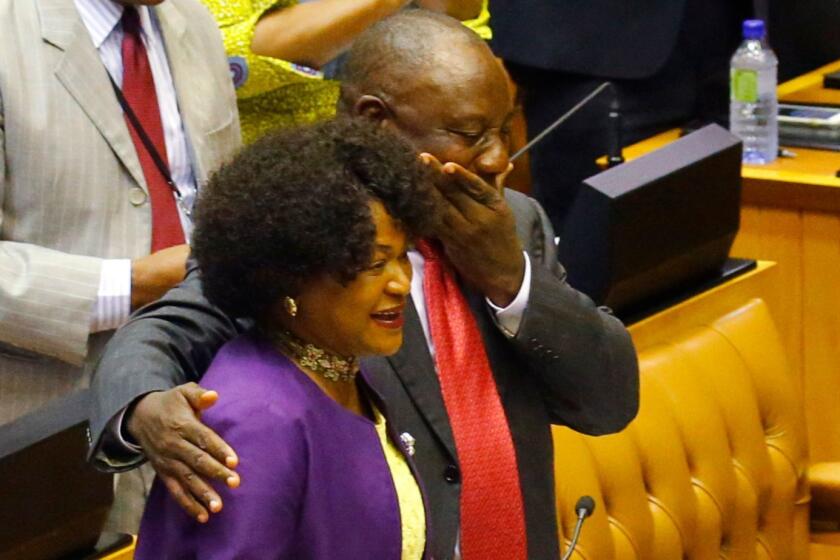 Former South African Deputy president Cyril Ramaphosa (R) reacts as he hugs South African National Assembly speaker Baleka Mbete (L) after being elected by the Members of Parliament during a session at the Parliament in Cape Town prior to his swearing in as South Africa's President, on February 15, 2018. South African lawmakers elected wealthy former businessman Cyril Ramaphosa on February 15, 2018 as the country's new president after scandal-tainted Jacob Zuma resigned under pressure from his own ANC ruling party. Ramaphosa was elected without a vote after being the only candidate nominated in the parliament in Cape Town, chief justice Mogoeng Mogoeng told assembled lawmakers. / AFP PHOTO / POOL AND AFP PHOTO / MIKE HUTCHINGSMIKE HUTCHINGS/AFP/Getty Images ** OUTS - ELSENT, FPG, CM - OUTS * NM, PH, VA if sourced by CT, LA or MoD **