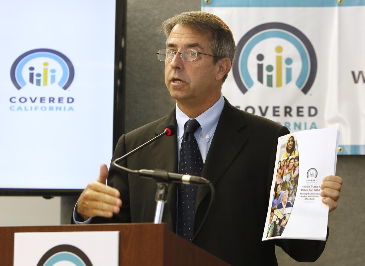 Peter Lee, executive director of Covered California, the state agency running the state's new health exchange, announces the plans and prices that will be offered by private insurers during a news conference in Sacramento.