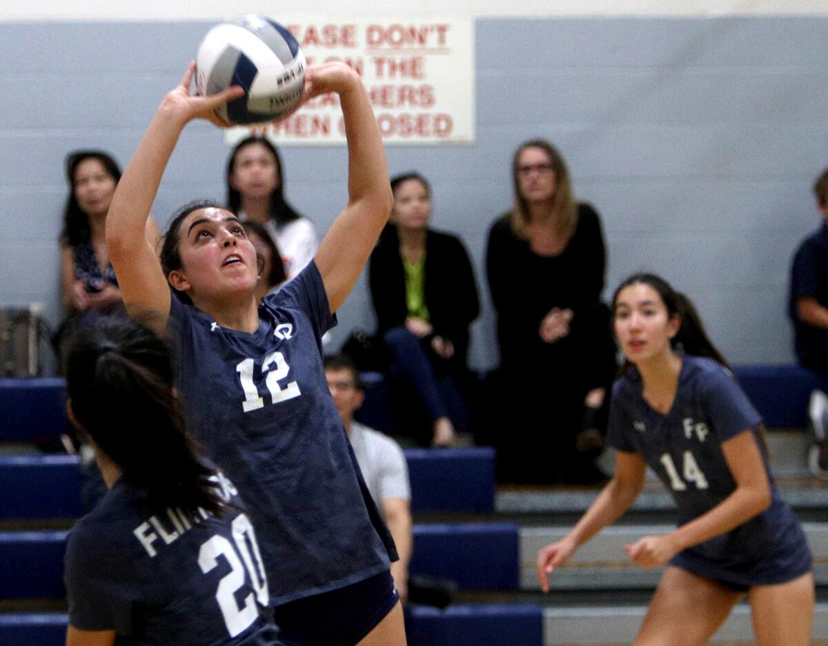 Flintridge Prep girls’ volleyball players #12 Ani Bernardi sets the all in game vs. Chadwick, at home in La Canada Flintridge on Tuesday, Oct. 1, 2019.