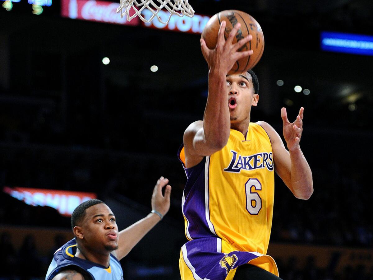 Jordan Clarkson drives past Grizzlies forward Jarell Martin during a game March 22 at Staples Center.