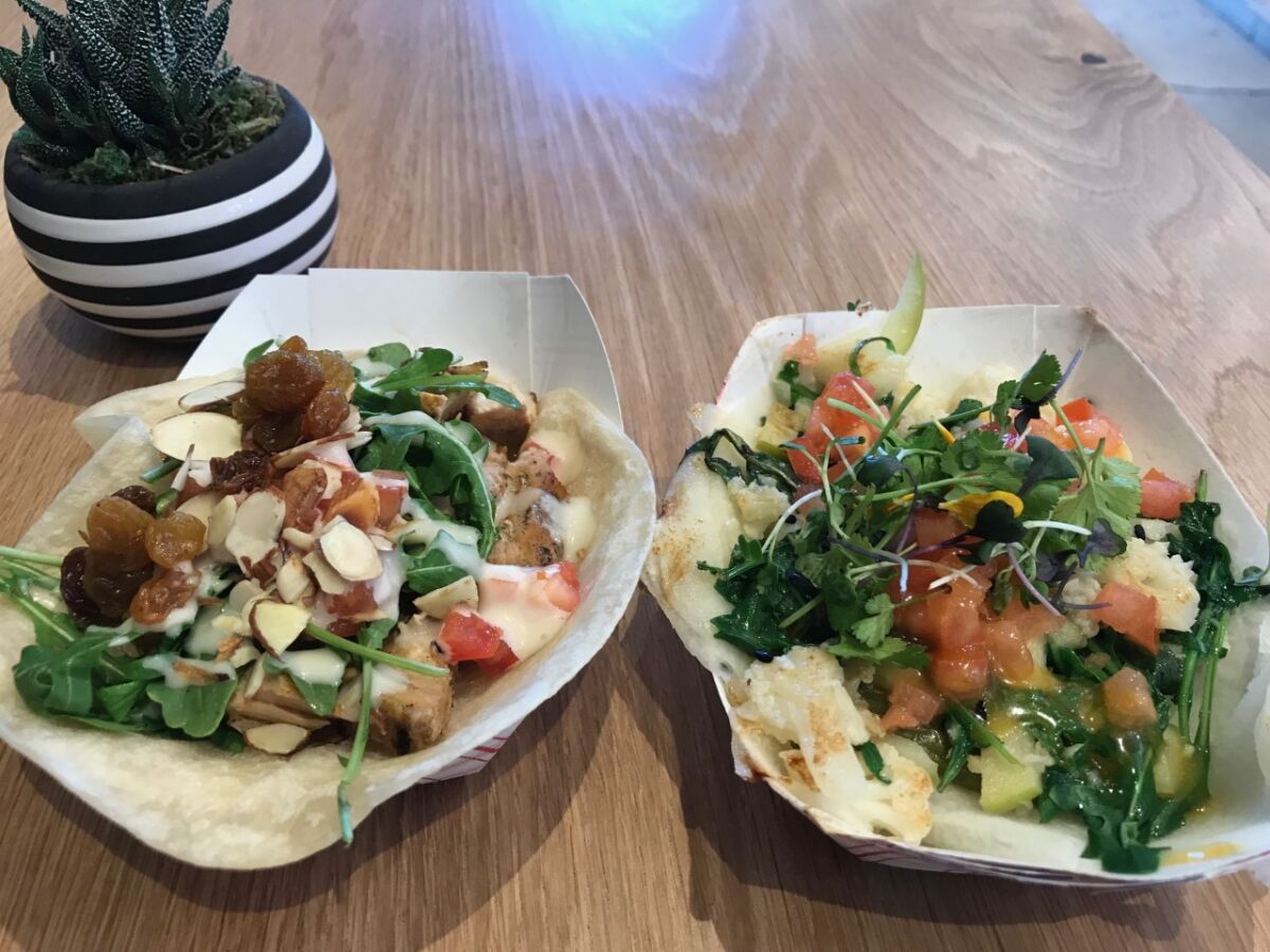 The Pollo City (left) and Coliflor tacos from City Tacos.