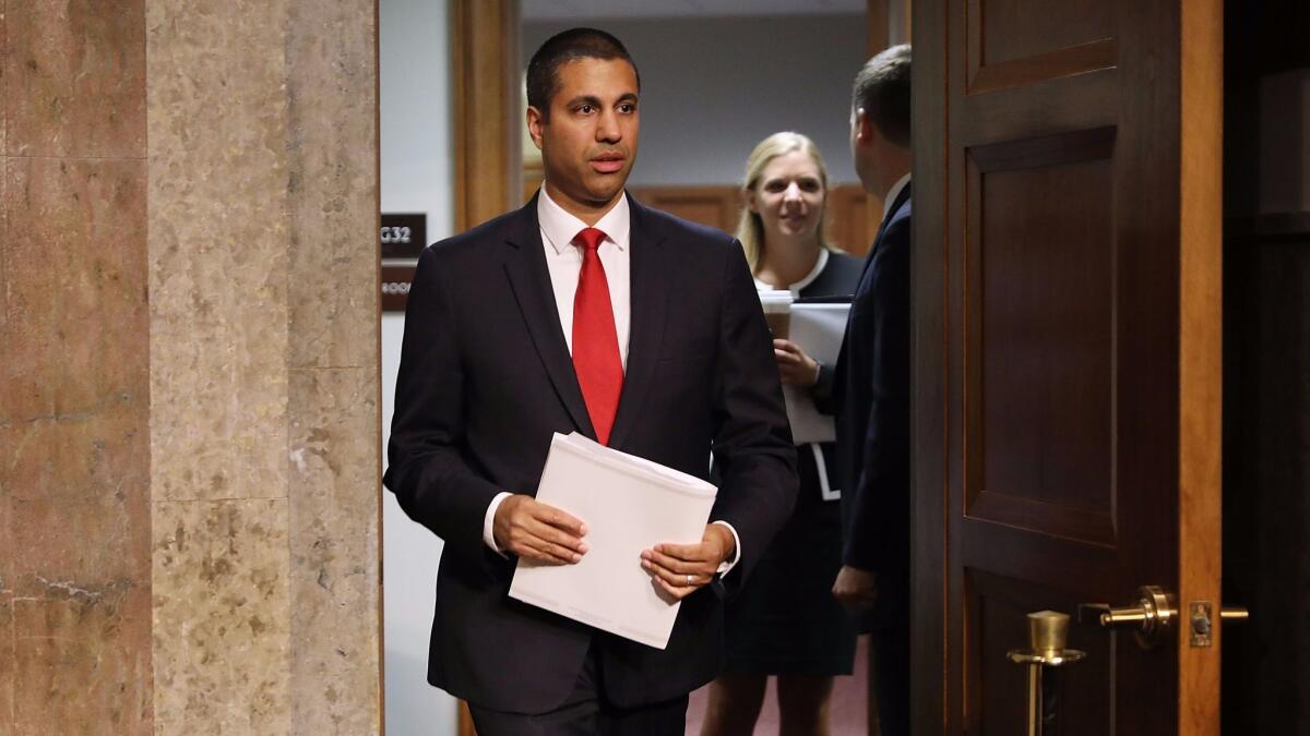 Ajit Pai, chairman of the Federal Communications Commission, arrives for a Senate hearing in July.