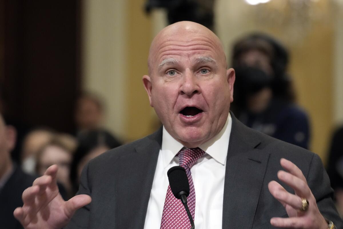 H.R. McMaster gestures and speaks into a mic 