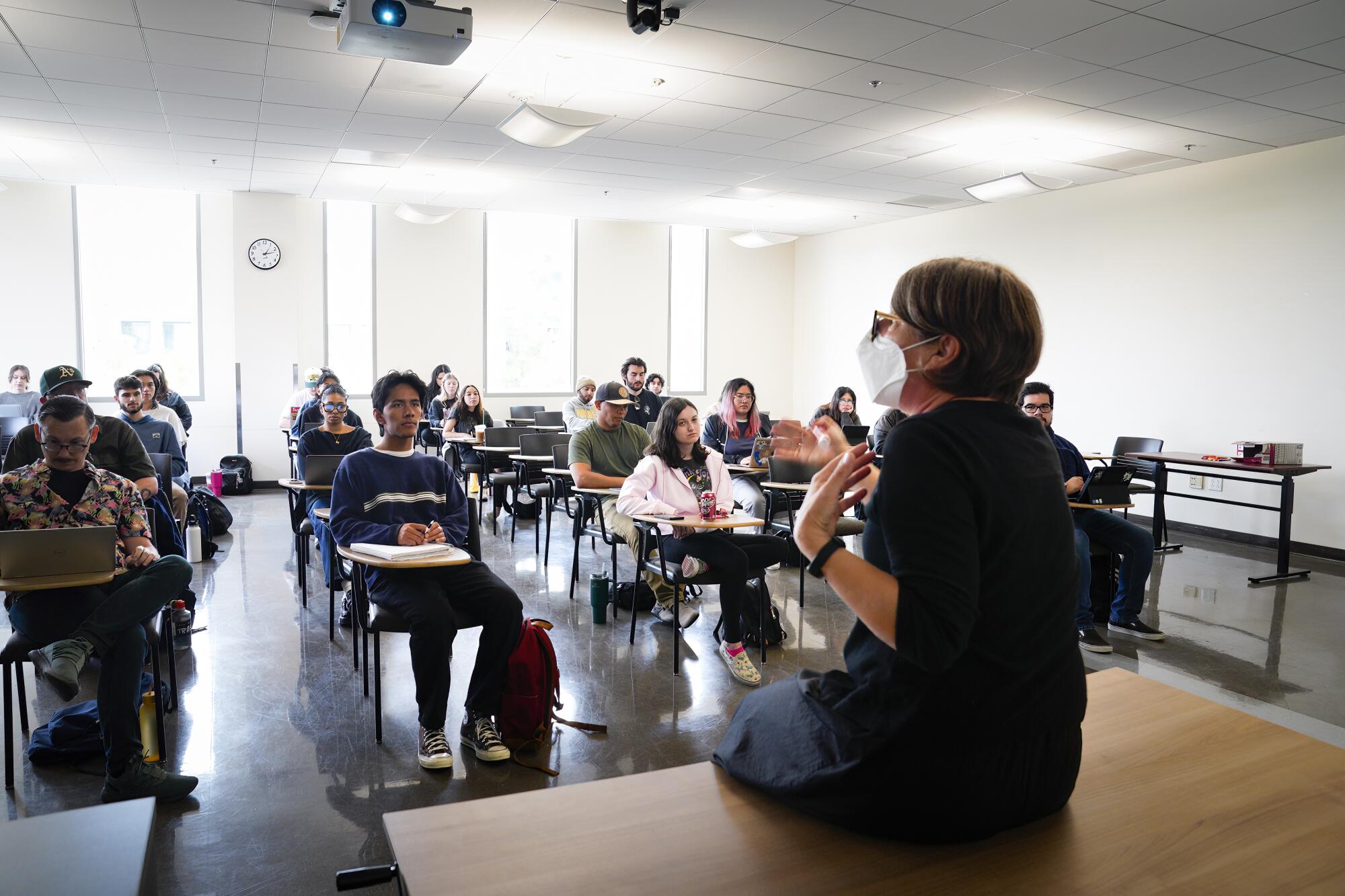 Ash Fogle was teaching social issues and popular culture on a recent Tuesday.