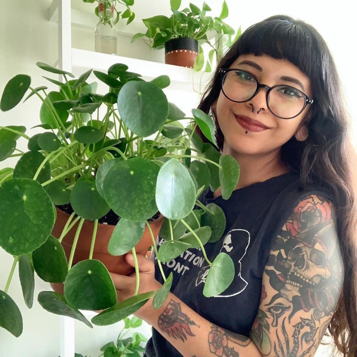 Reader Skye Gonzalez with her Pilea peperomioides