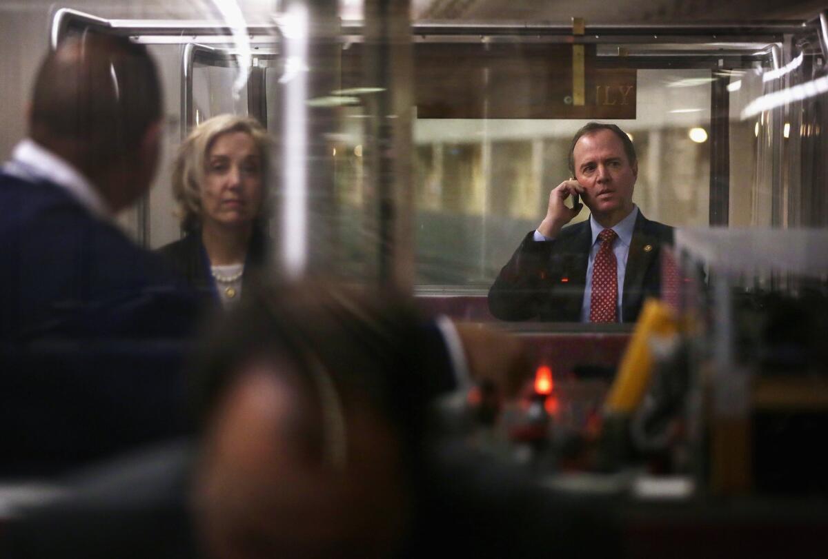 Rep. Adam Schiff (D-Burbank) talks on his phone while riding the House subway on Jan. 28 on Capitol Hill.