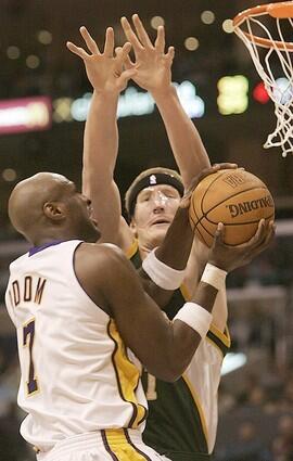 Lakers forward Lamar Odom gets fouled by Sonics center Robert Swift in the fourth quarter.