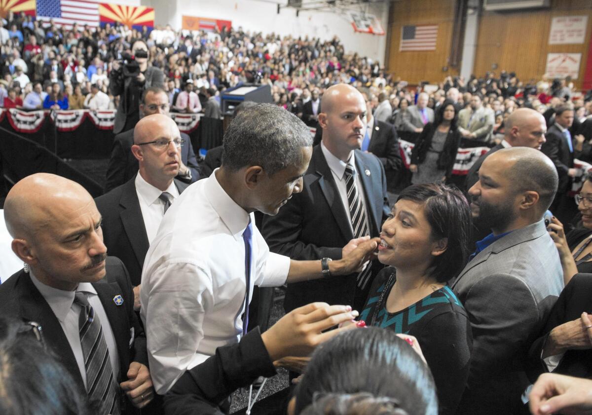 President Obama greets audience members after speaking in Phoenix on Thursday; he has announced a plan to make community college fee-free for millions of high school graduates.
