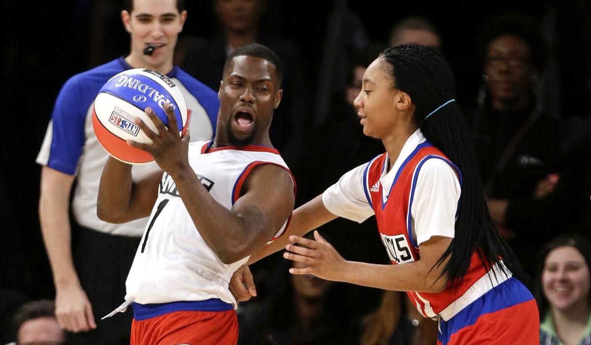Mo'ne Davis plays defense against Kevin Hart during the first half of the NBA All-Star Celebrity basketball game on Friday.