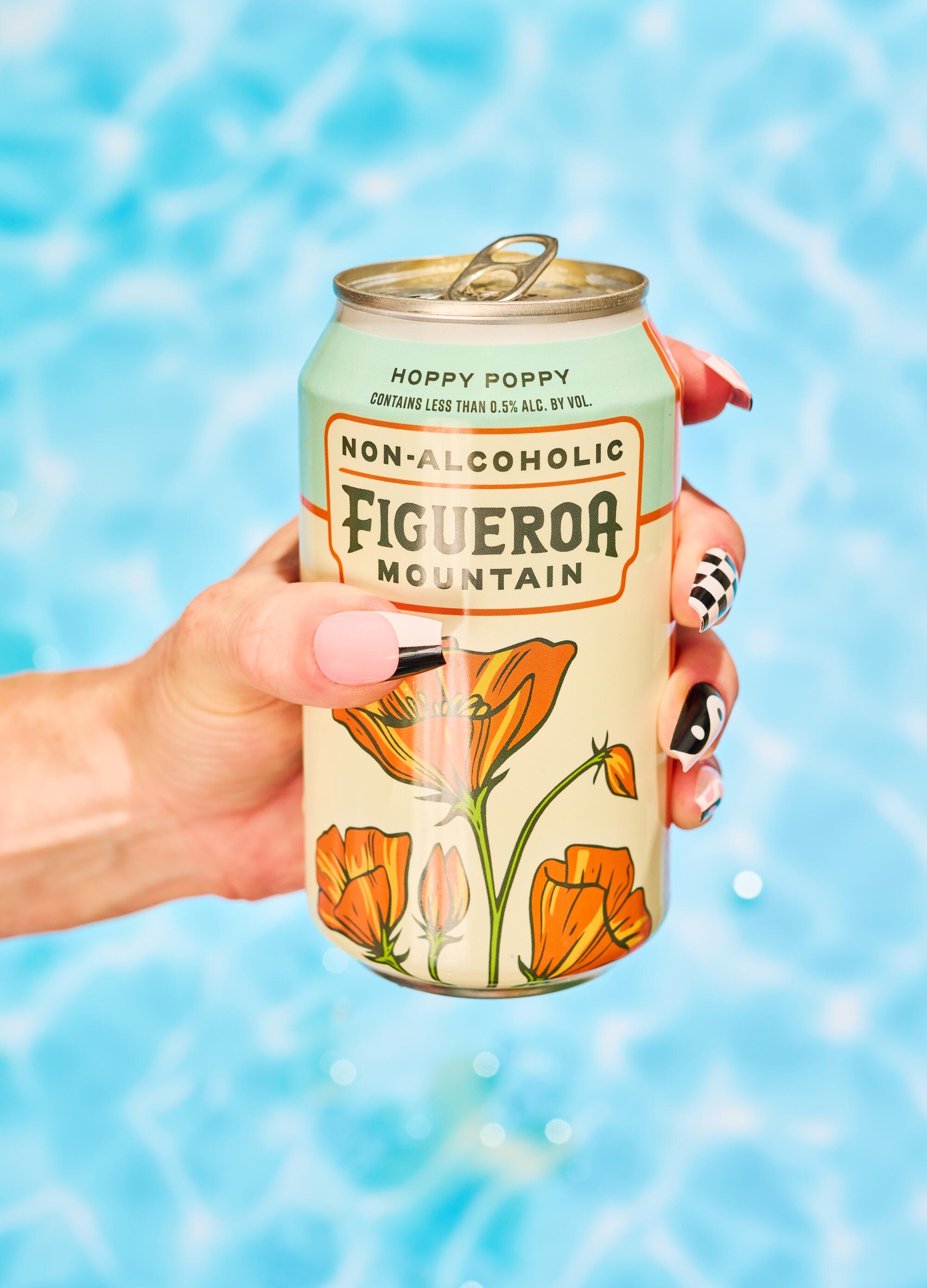 hand holding Figueroa beer can