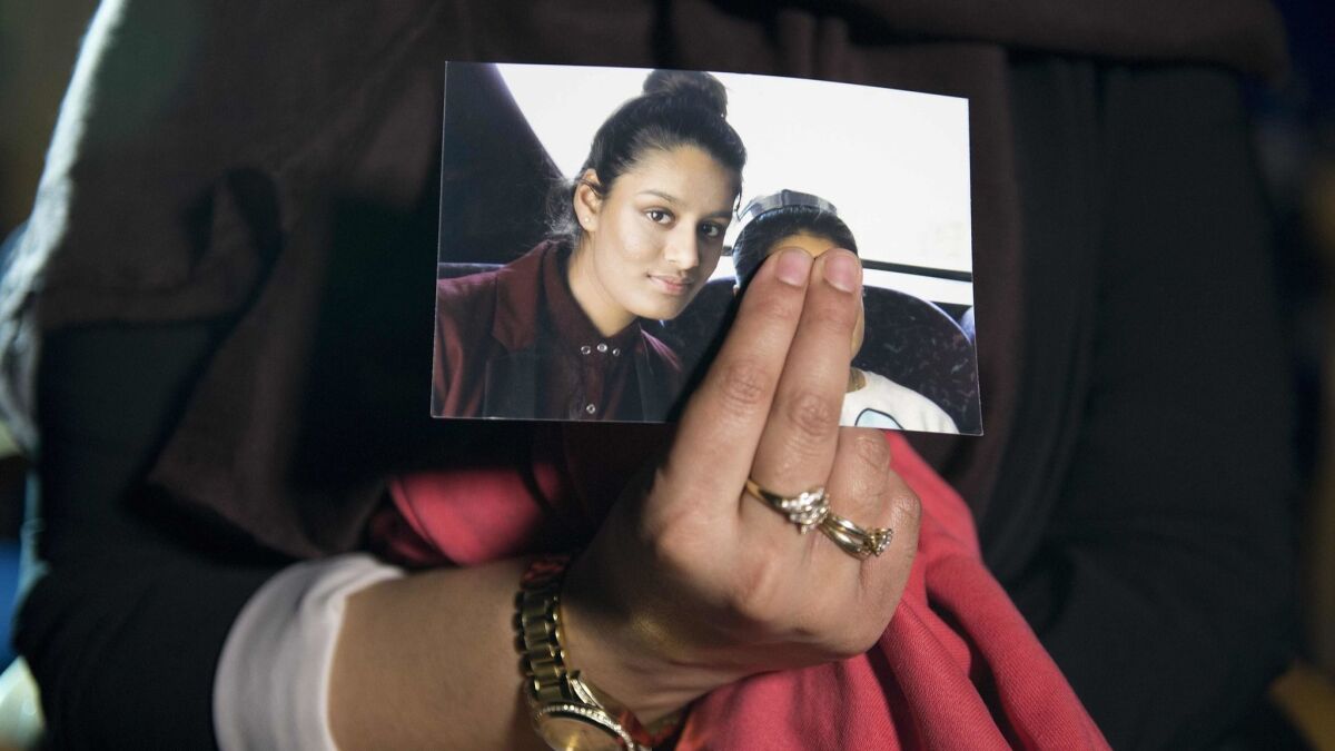 Renu Begum in 2015 holds a picture of her younger sister Shamima Begum during an interview in February 2015. The British girl ran away at 15 to join Islamic State and marry a fighter.