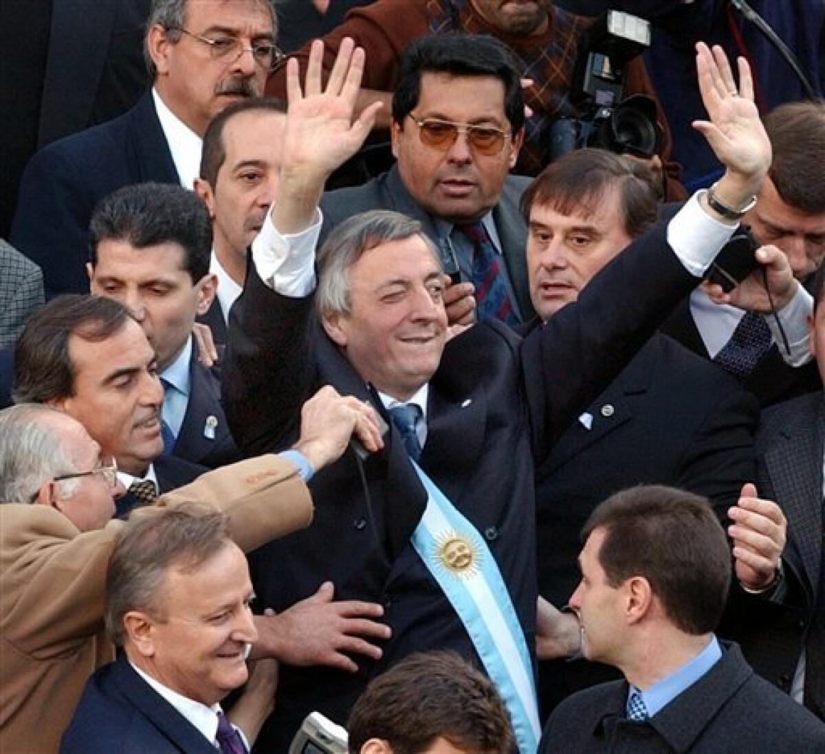 FILE - In this May 25, 2003 file photo, Argentina's President Nestor Kirchner waves to supporters after being sworn-in at Congress in Buenos Aires, Argentina. According to state television in Argentina, Nestor Kirchner died on Wednesday Oct. 27, 2010 after suffering heart attacks at age 60. Kirchner served as president from 2003-2007. (AP Photo/Natacha Pisarenko, File)