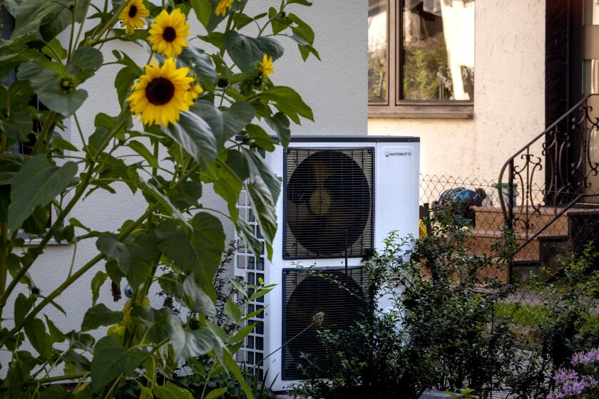 A heat pump is installed at a house in Frankfurt, Germany, Thursday, Sept. 7, 2023. (AP Photo/Michael Probst)