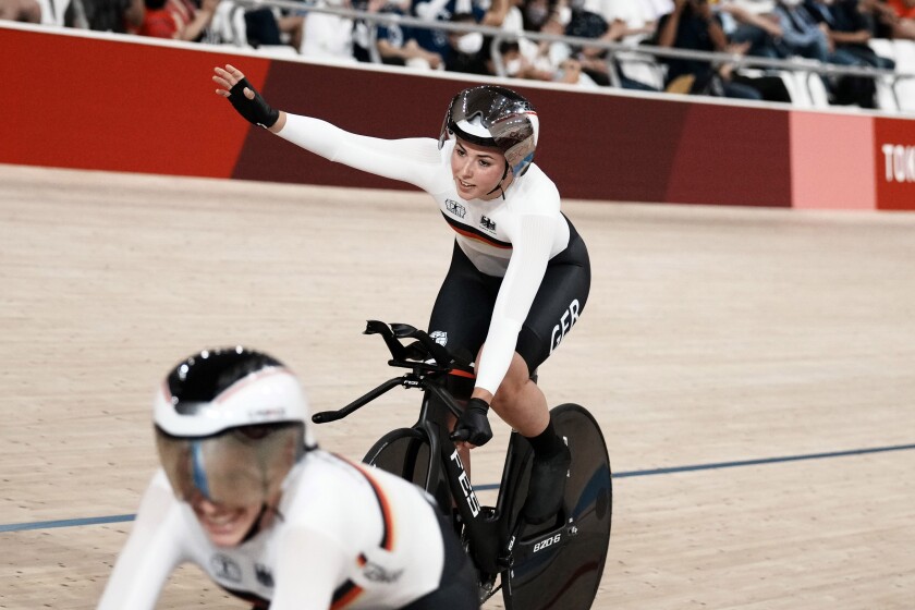 Lisa Klein of Team Germany celebrates a world record as they win gold the track cycling women's team pursuit at the 2020 Summer Olympics, Tuesday, Aug. 3, 2021, in Izu, Japan. (AP Photo/Thibault Camus)