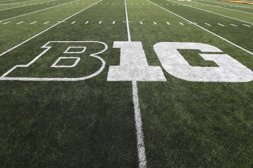 FILE - In this Aug. 31, 2019, file photo, the Big Ten logo is displayed on the field before an NCAA college football game between Iowa and Miami of Ohio in Iowa City, Iowa. The Big Ten released its 10-game conference-only football schedule beginning as early as Labor Day weekend but cautioned there is no certainty games will be played. (AP Photo/Charlie Neibergall, File)
