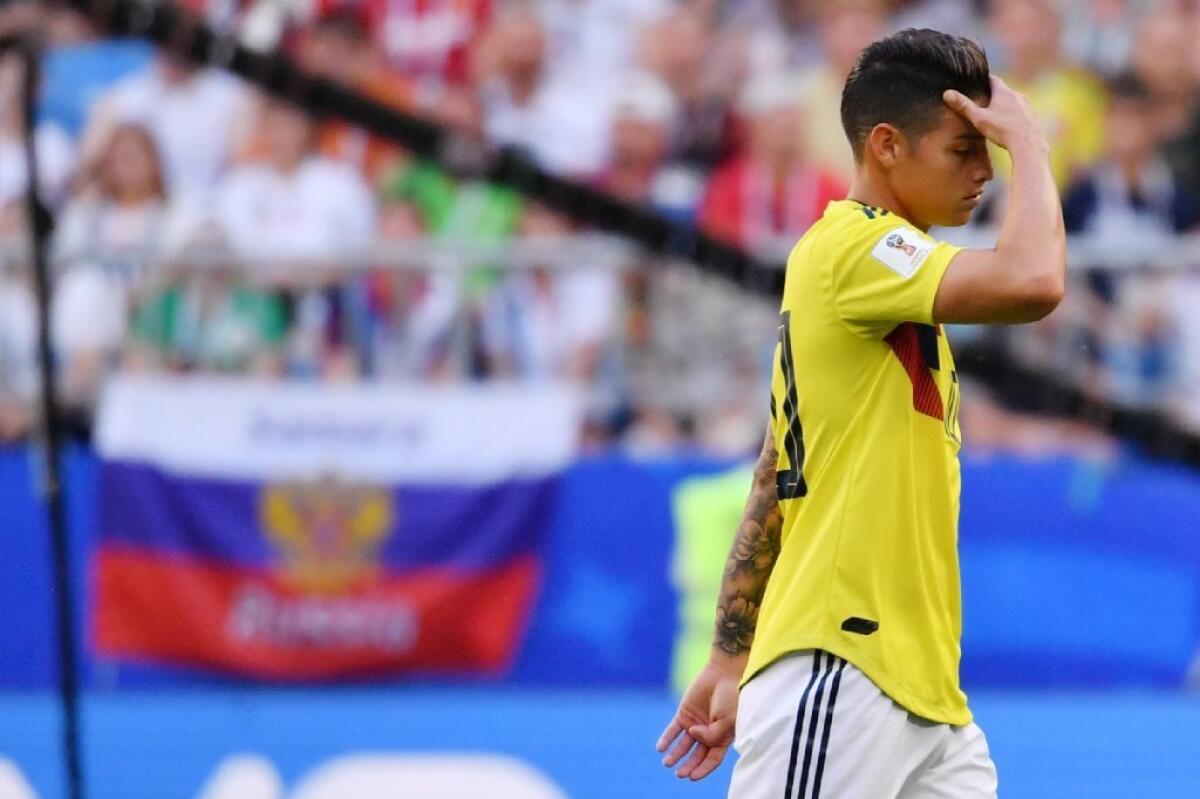 Colombia midfielder James Rodriguez walks off the field after getting injured during a Group H match against Senegal on Thursday.