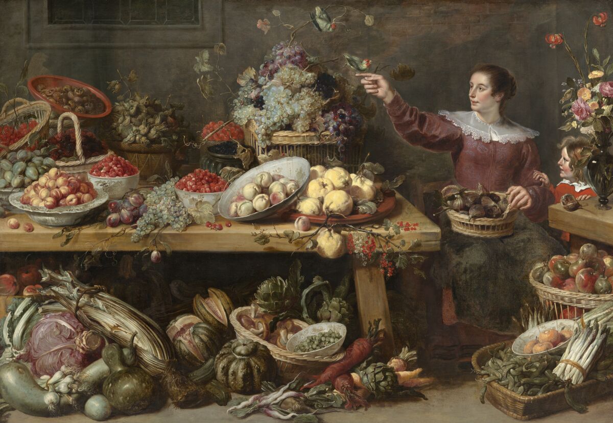 A painting of a seated woman holding out her hand next to a table laden with various fruits and vegetables 