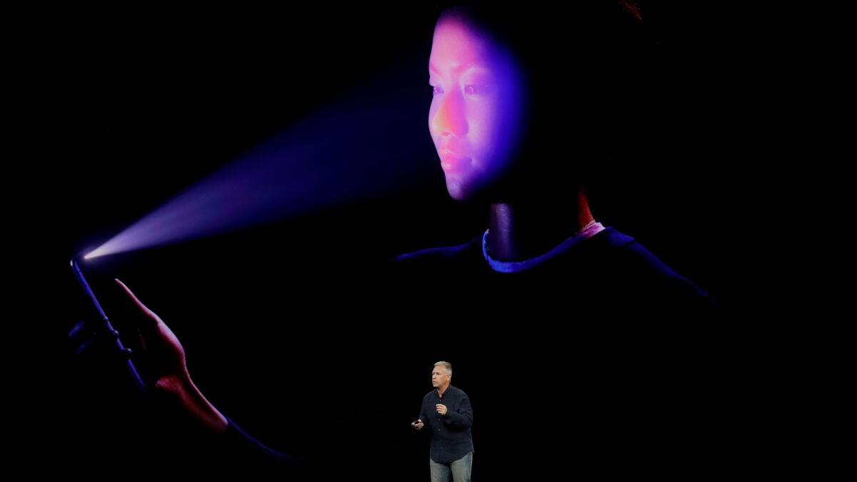 Apple wants customers to unlock the new iPhone X with its facial recognition technology, Face ID. Above, Phil Schiller, Apple's senior vice president of worldwide marketing, announces the feature Tuesday at the company's headquarters in Cupertino, Calif.