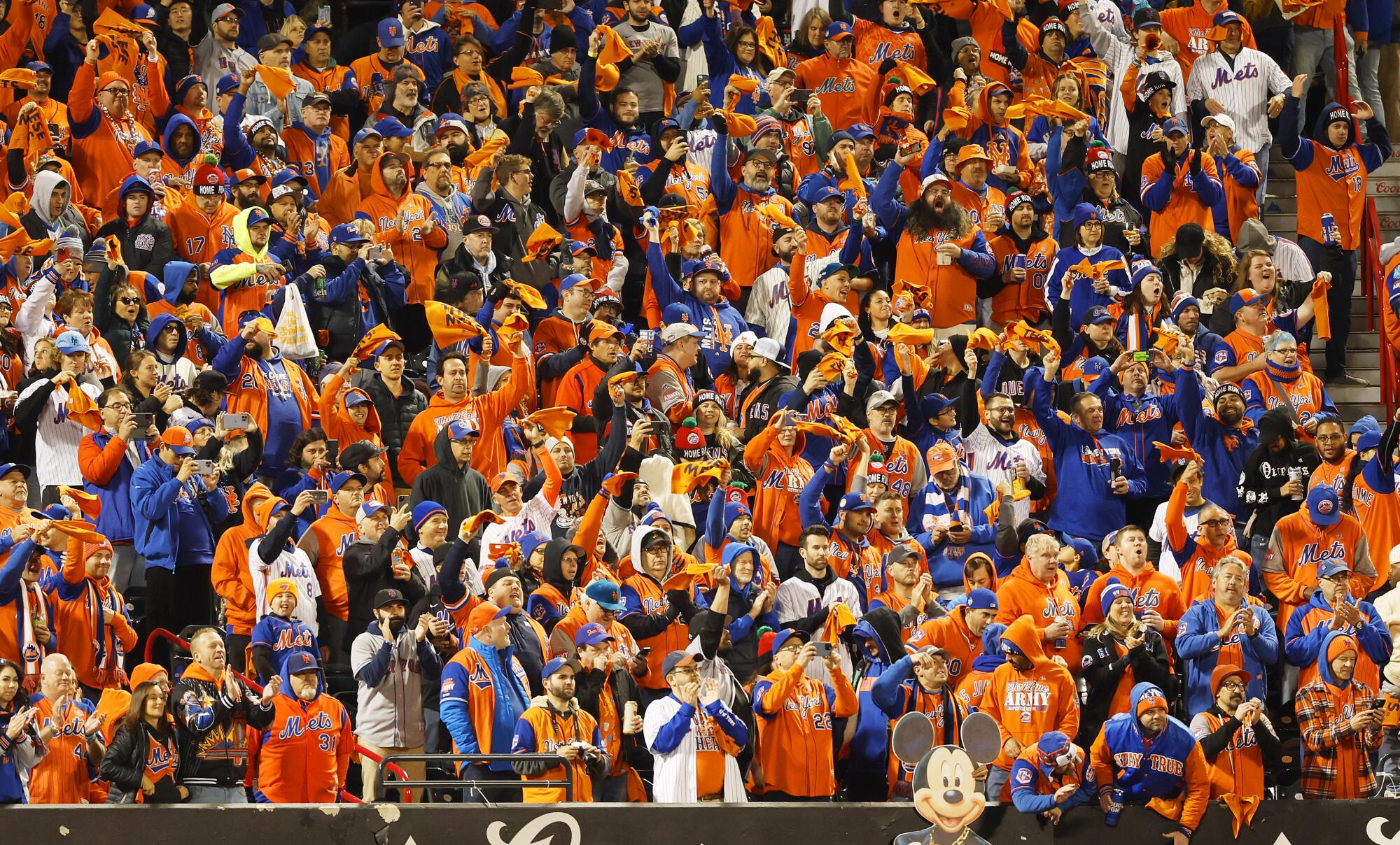Mets fans cheer during Game 2 of the NL wild-card series at Citi Field.