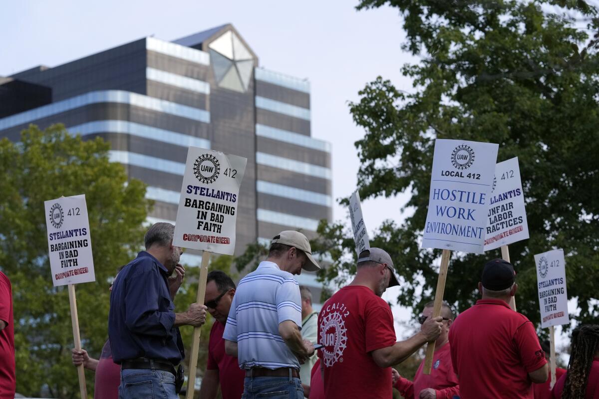 United Auto Workers march outside the Stellantis North American Headquarters