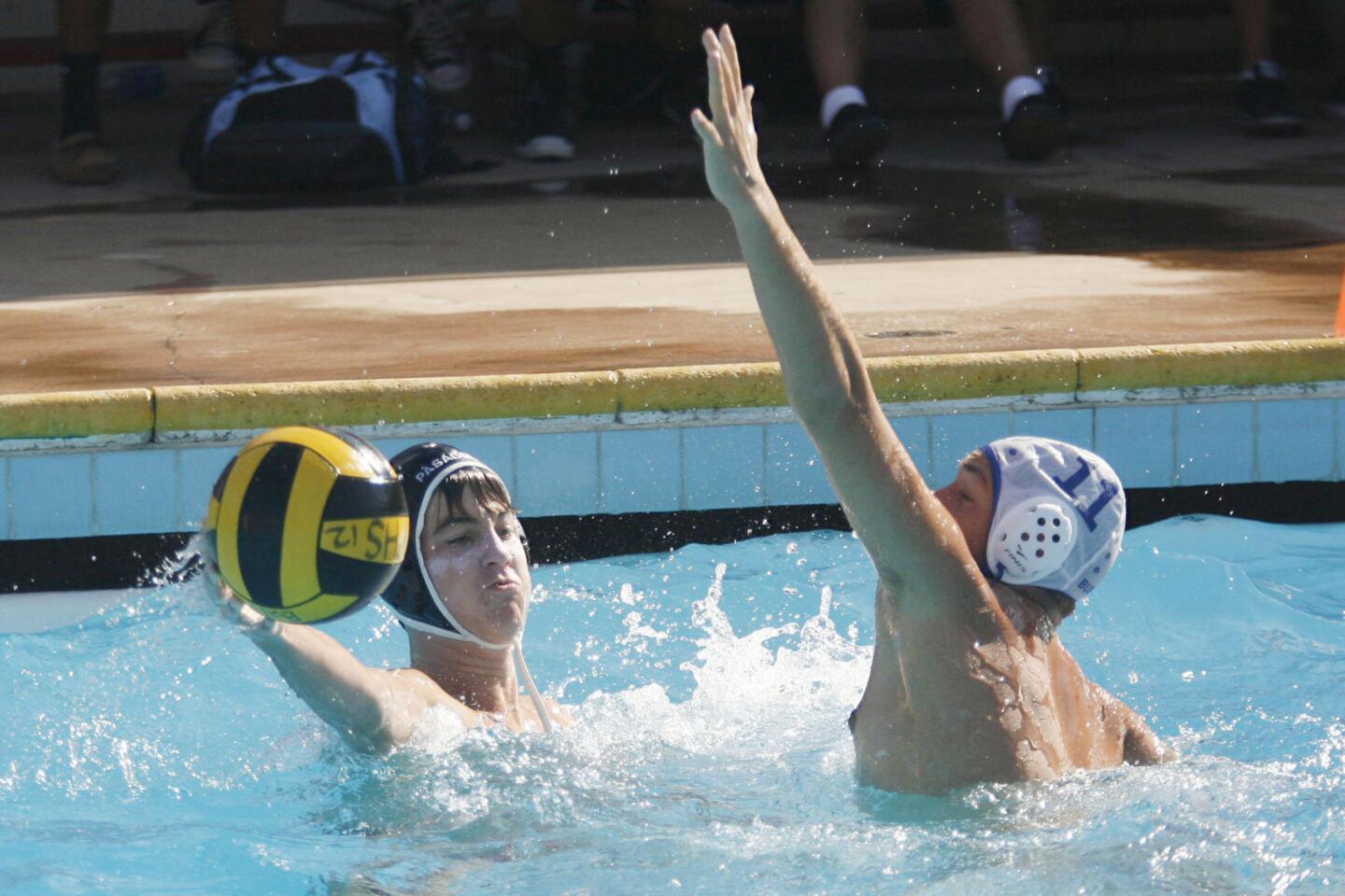 Pasadena's Matthew Klein, tries to make a pass while Burbank's Shant Piramzyan tries to block Klein during a match at Pasadena High School on Tuesday, October 2, 2012.