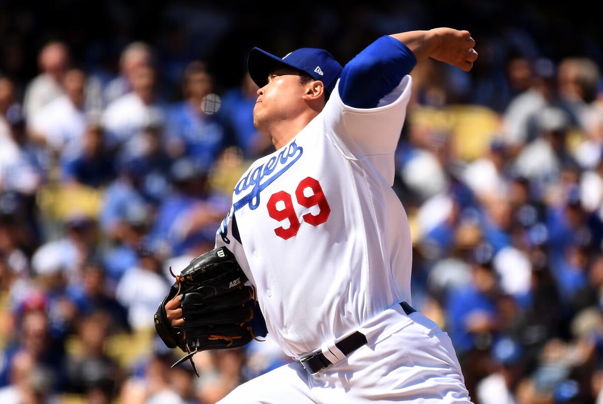 Dodgers opening-day starter Hyun-Jin Ryu delivers a pitch during the first inning of Thursday's 12-5 victory over the Arizona Diamondbacks.