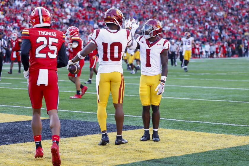 USC wide receiver Kyron Hudson celebrates with Zachariah Branch after scoring a touchdown against Maryland Saturday