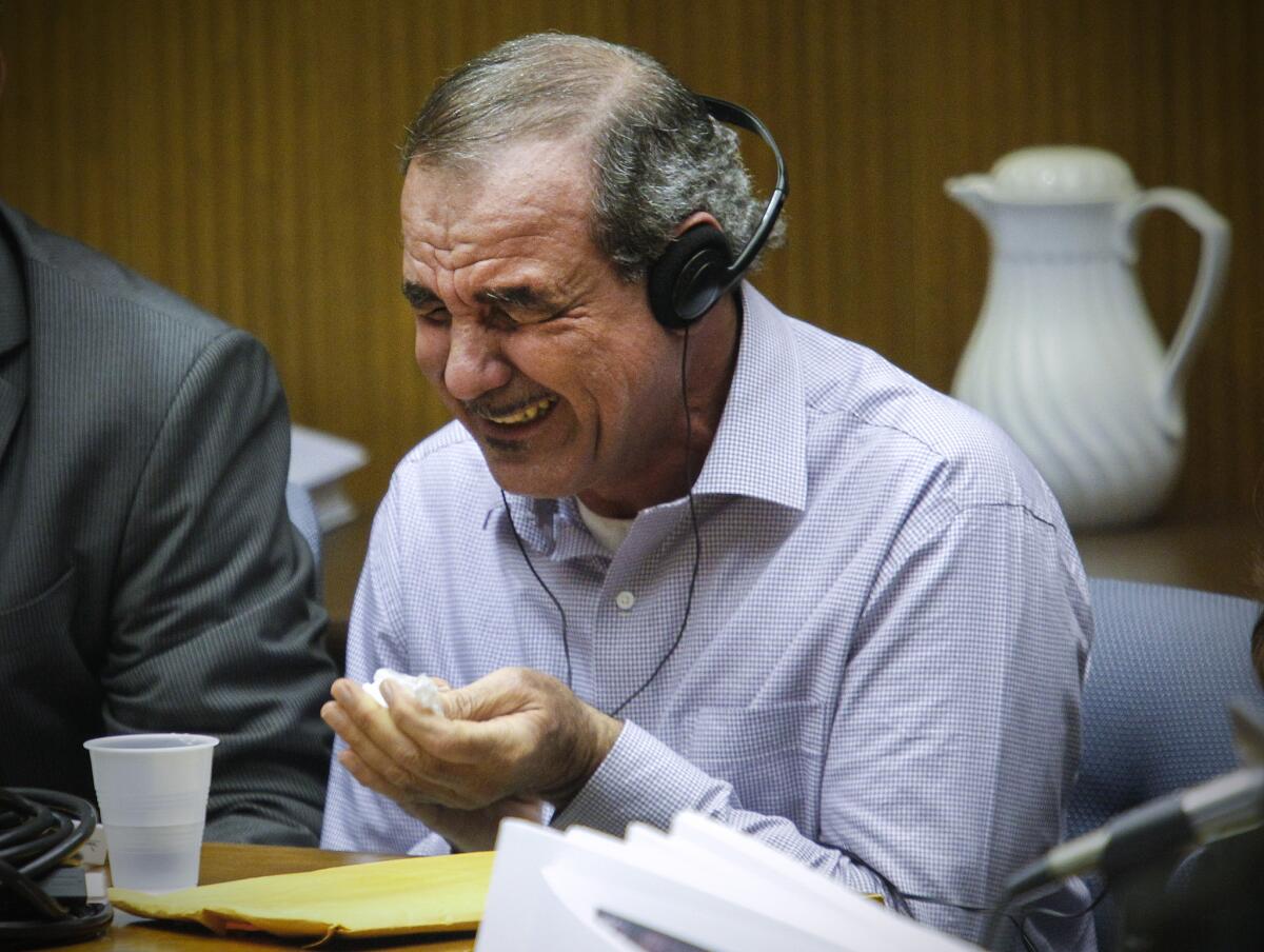 Kassim Al-Himidi weeps during his murder trial.