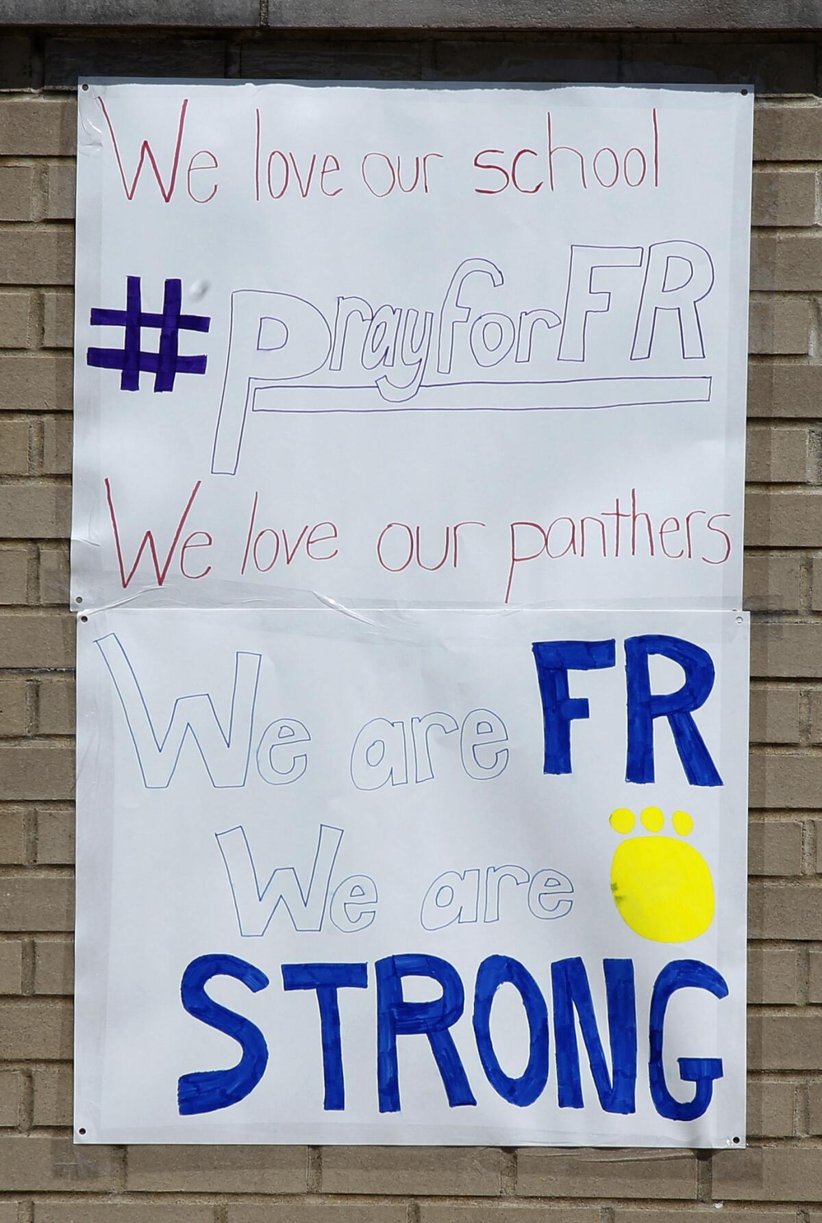 A student-made sign shows school spirit at Franklin Regional High School the day after a stabbing attack Wednesday.