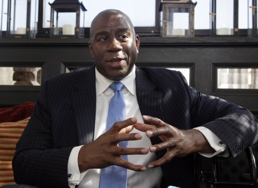 Magic Johnson, shown in 2013, is devoting $100 million in loans to minority- and women-owned small businesses.