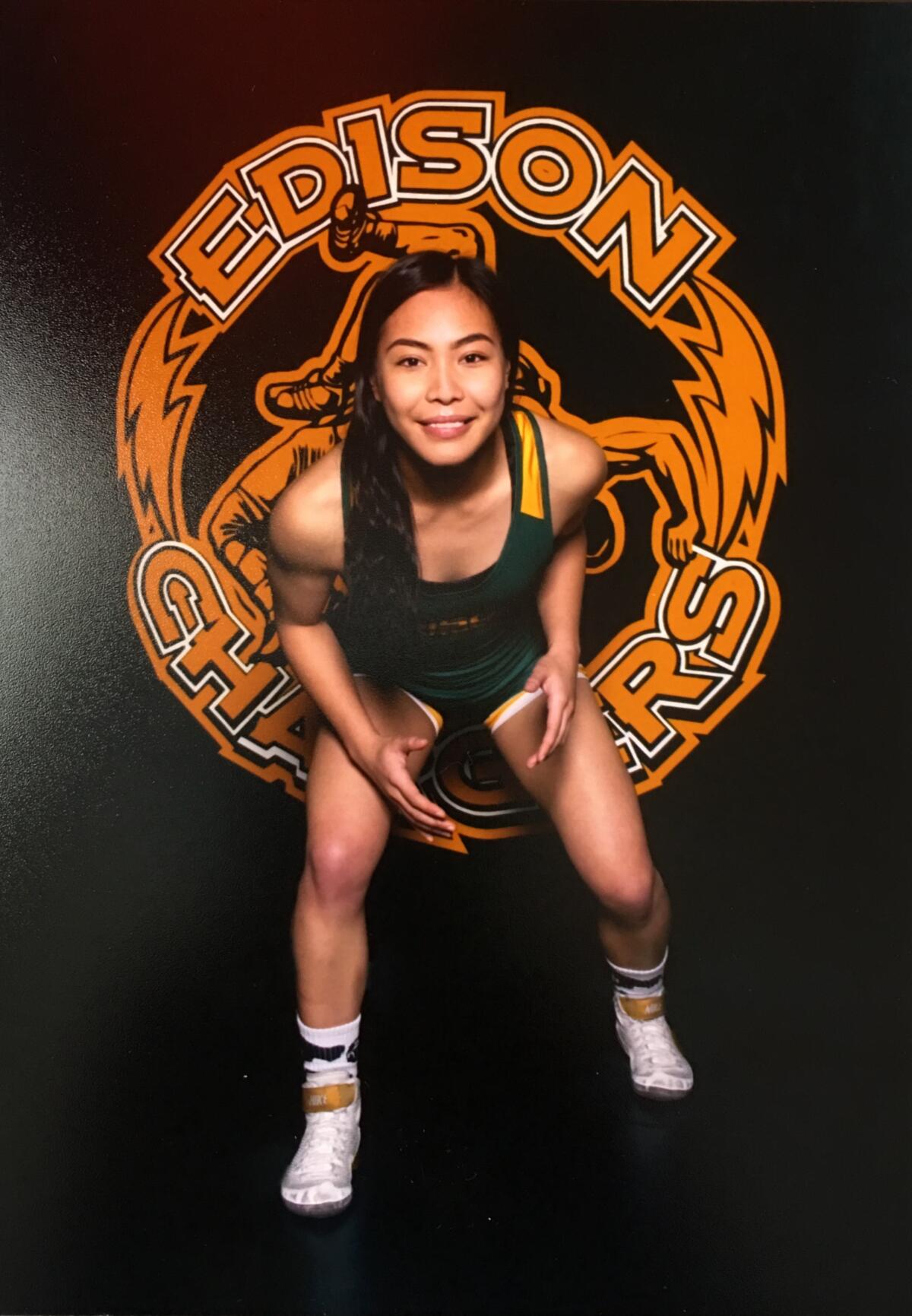 Edison's Angela Dela Cruz went 32-6 in her senior season. She was the first girls' wrestler to become a CIF State-qualifier for the Chargers.
