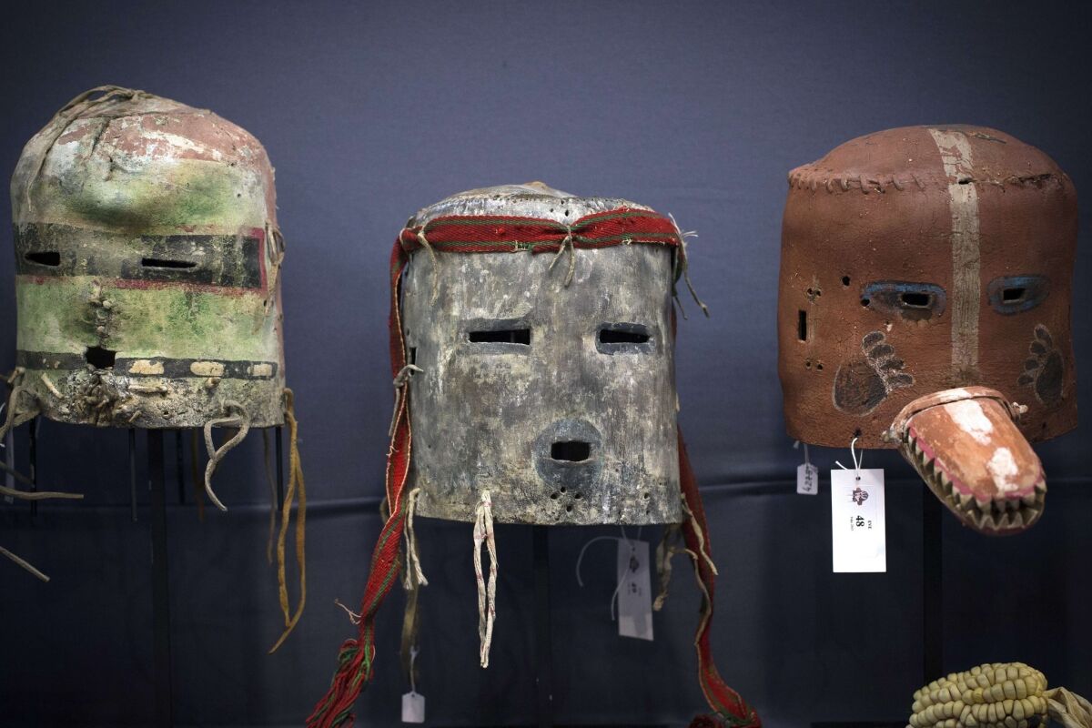 A view of three Hopi masks from Arizona during a Paris auction of sacred objects from the Hopi and San Carlos Apache Native American tribes.