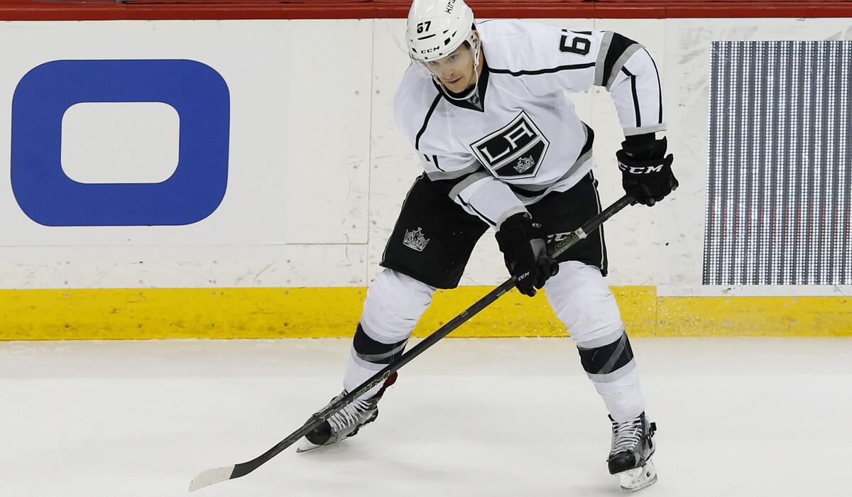 Los Angeles Kings' Nic Dowd, making his NHL debut, plays against the Minnesota Wild in the first period on Tuesday.