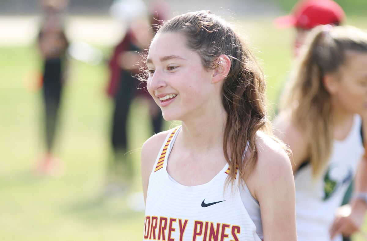 Freshman Scarlett Taylor was all smiles after winning in her cross country debut.