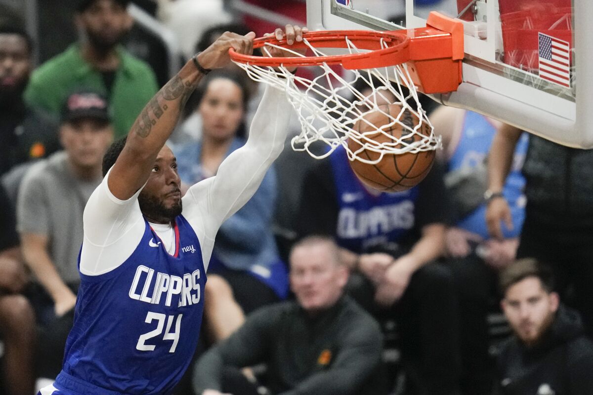 Clippers guard Norman Powell throw down a dunk during Game 3.